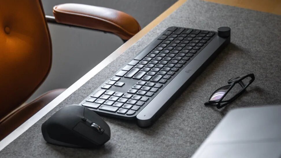 a keyboard and mouse on a desk