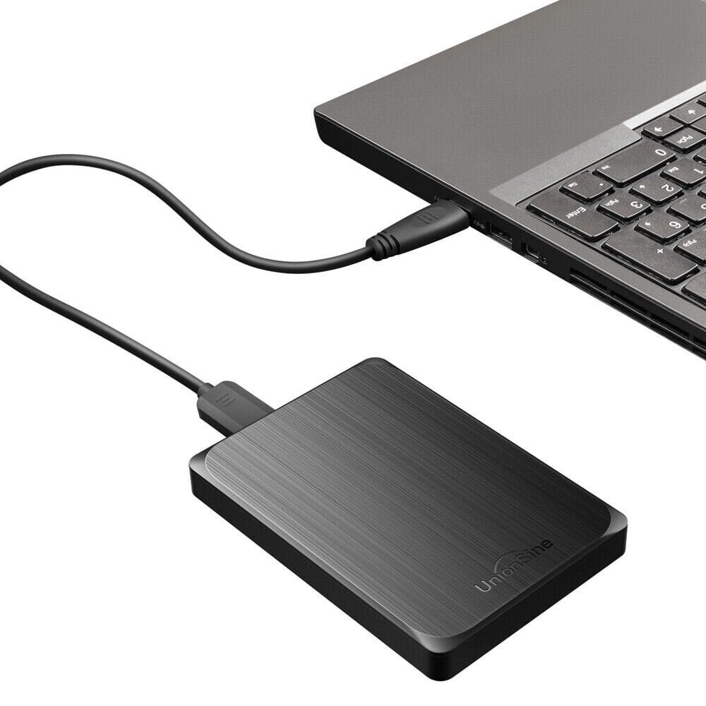 a black hard drive connected to a laptop