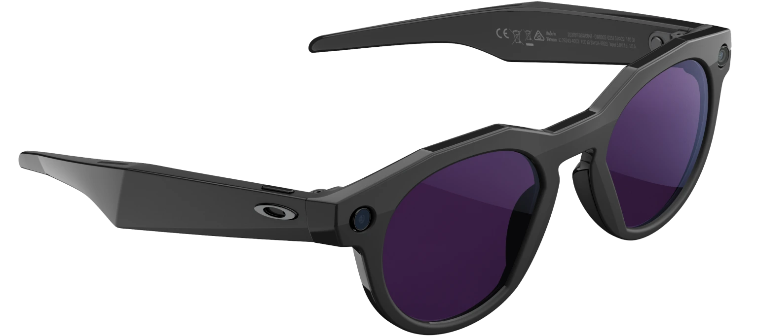 A close-up of the Oakley Meta glasses showing the integrated camera and speakers.
