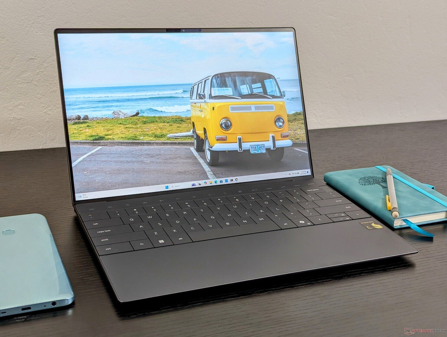 The Dell XPS 13 with Snapdragon in Graphite on a clean desk.
