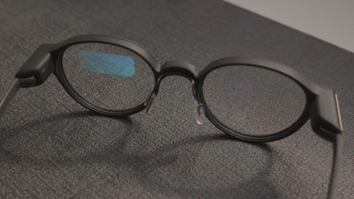 A lifestyle image of the Even Realities G1 smart glasses, which look like regular glasses.